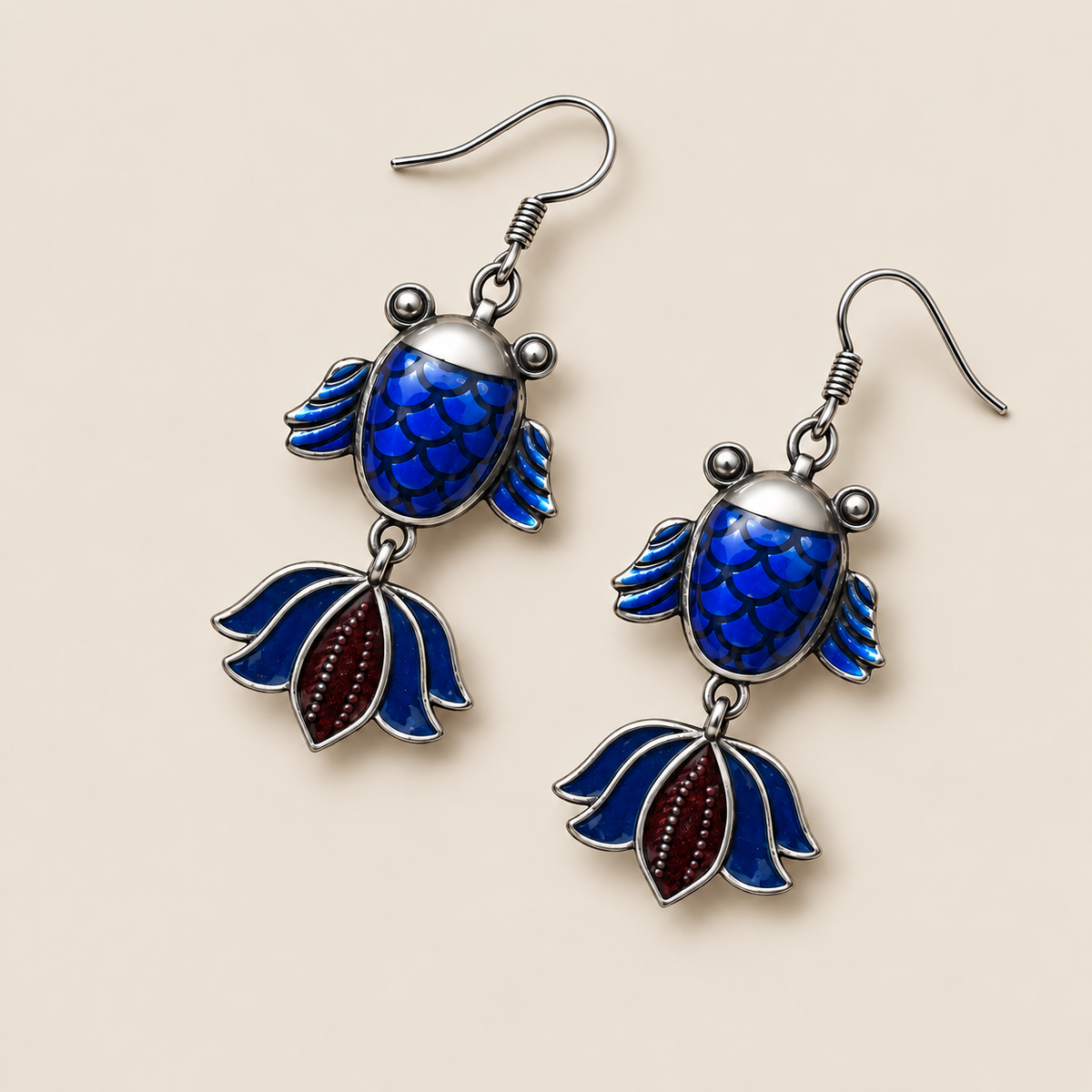 Amber Rhythm handmade fish earrings, blue enamel reverse