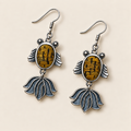 Amber Rhythm handmade fish earrings, front flat lay