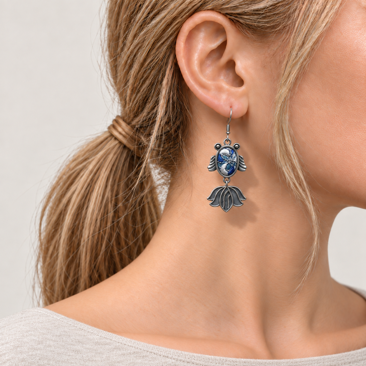 Azure Cadence handmade fish earrings, front worn