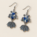 Azure Cadence handmade fish earrings, front flat lay