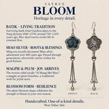 Batik craft information panel with front and reverse views of Midnight Blossom earrings, showing the textile flower and bird relief design.