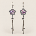 Lilac Serenade floral tassel earrings, front view showing lilac and pink petals with pale curved lines in flower-shaped metal frames with three chain tassels with rounded drops.