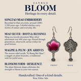 Songtao embroidery craft information panel with front and reverse views of Fuchsia Dawn earrings, showing the textile flower and bird relief design.