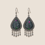 Midnight Currents batik teardrop earrings with pale spirals on dark textile, pink and green accents and five short drops.