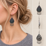 Model wearing a Midnight Currents batik earring, beside front, side and wave-relief reverse views.