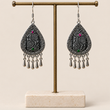 Midnight Currents batik earrings hanging from a T-bar stand with five short drops beneath each teardrop.