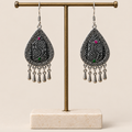 Midnight Currents batik earrings hanging from a T-bar stand with five short drops beneath each teardrop.