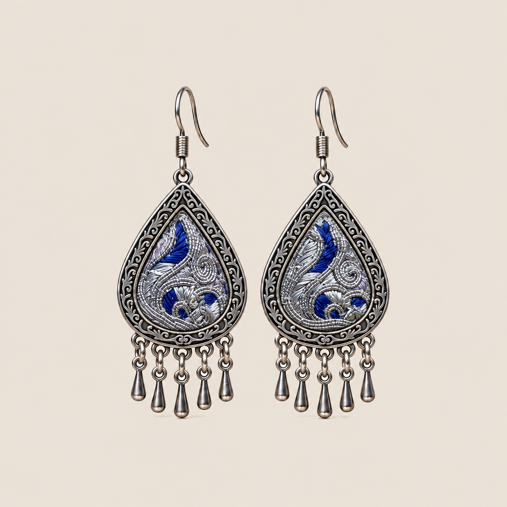 Silver Tide teardrop earrings with deep-blue Panjin embroidery and five short drops on each earring.