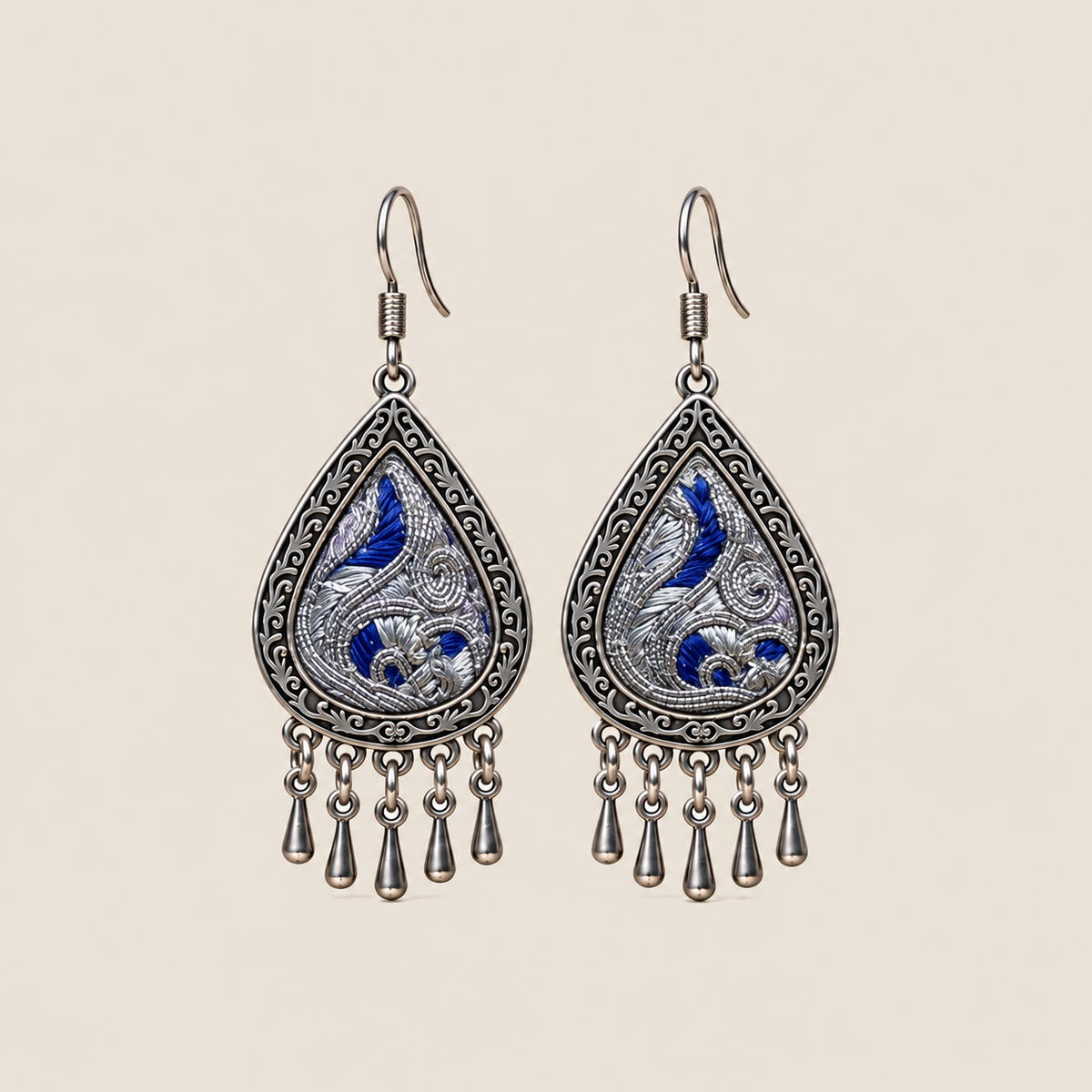 Silver Tide teardrop earrings with deep-blue Panjin embroidery and five short drops on each earring.