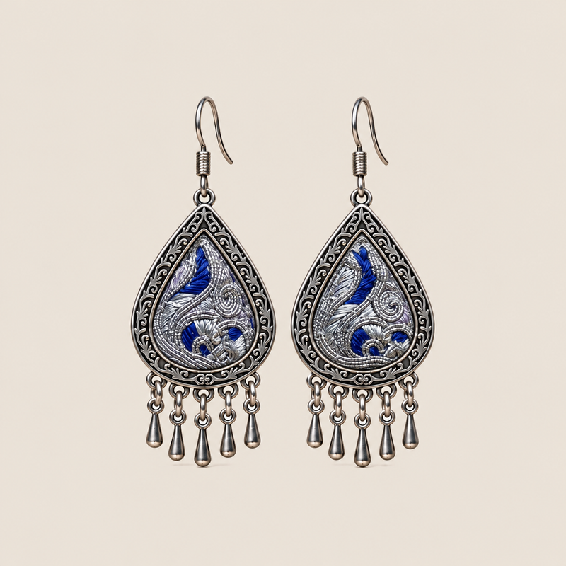 Silver Tide teardrop earrings with deep-blue Panjin embroidery and five short drops on each earring.