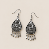 Reverse view of Silver Tide earrings showing raised wave patterns and five short drops on each earring.