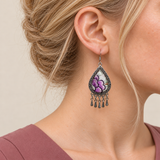Close-up of a Lavender Sonata earring worn with purple embroidered petals and green and brown accents on a pale ground.