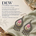 Blush Reverie earrings on pale green cloth beside a botanical sketch, dried flowers and a dish in the A flower that stays story panel.