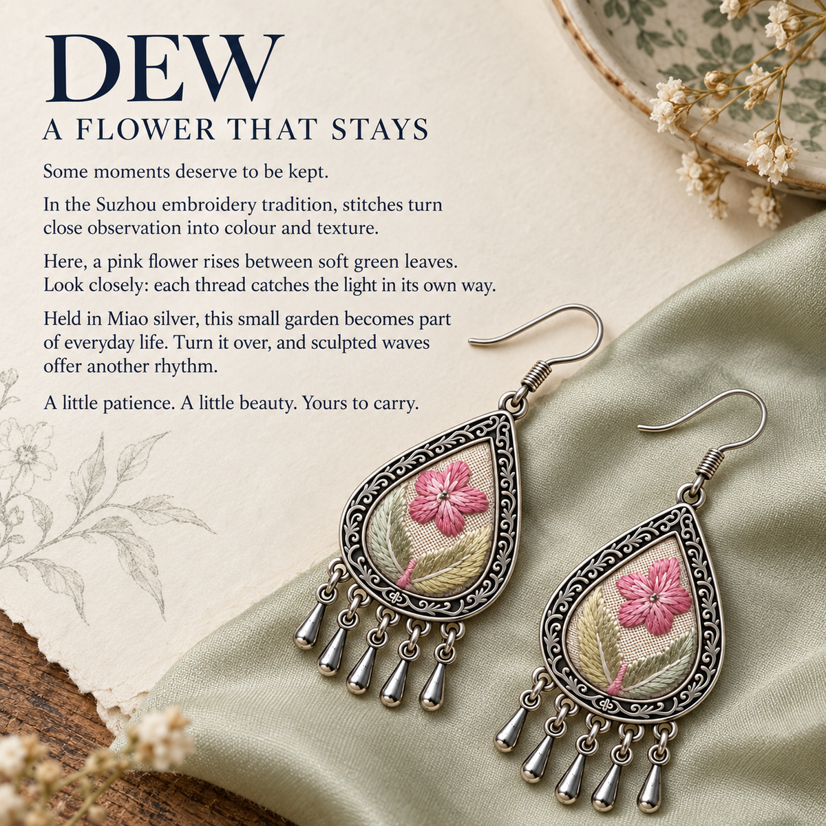 Blush Reverie earrings on pale green cloth beside a botanical sketch, dried flowers and a dish in the A flower that stays story panel.