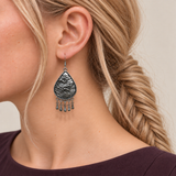 Close-up of a Prismatic Reverie earring worn with its sculpted wave-relief reverse facing outward.