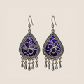 Violet Arabesque teardrop earrings with silver-white Panjin embroidery curves on purple textile and five short drops.
