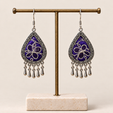 Violet Arabesque Panjin embroidery earrings hanging from a T-bar stand with five short drops beneath each teardrop.