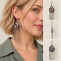 Model wearing a Burgundy Nocturne long tassel earring, beside front, side and wave-relief reverse views.