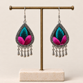 Fuchsia Tide Songtao embroidery earrings hanging from a T-bar stand with five short drops beneath each teardrop.