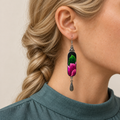 Verdant Blush earring worn with green and pink Songtao Embroidery facing forward above a single engraved teardrop.