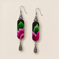Front close-up of Verdant Blush earrings, showing different green and pink stitched sections on black textile panels.