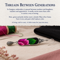 Songtao Embroidery story card with a Verdant Blush earring beside green and pink thread spools, a needle and black cloth.