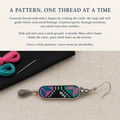 Counted-thread embroidery story card with a Pastel Cadence earring beside pink and teal thread, a needle and black cloth.