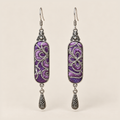 Violet Luminance Panjin Embroidery earrings featuring purple stitching with pale looping outlines, with one engraved teardrop each.