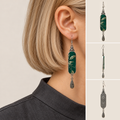 Model wearing an Emerald Reverie long drop earring, alongside front, side and back product views.
