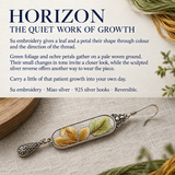 HORIZON story card with an Autumn Sonata earring on pale woven fabric beside green and ochre threads and a wooden prop.