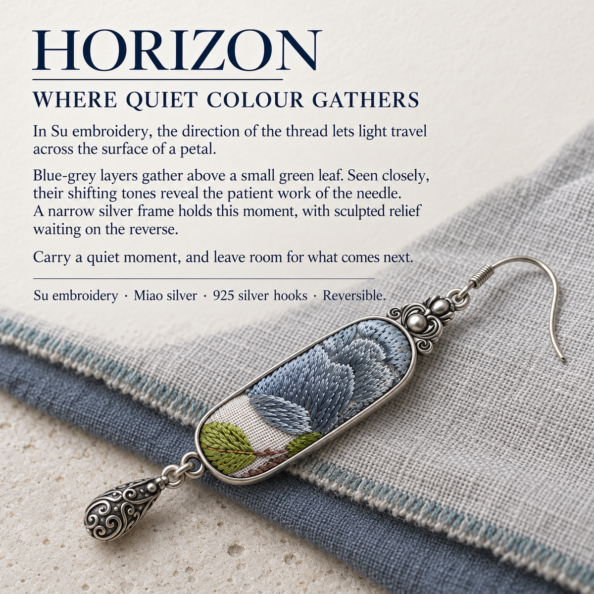 HORIZON story card with a Blue Reverie earring resting diagonally across layered gray and blue woven fabrics.
