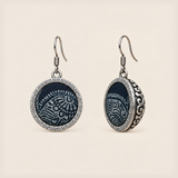 Indigo Cosmos Batik round earrings with pale curved patterns on indigo textile, geometric metal rims and domed scrollwork backs.
