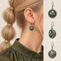 Verdant Bloom earring worn with its green floral front facing outward, beside front, 45-degree and domed reverse views.