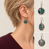 Jade Arabesque earring worn with its embroidered front facing outward, beside front, 45-degree and domed reverse views.