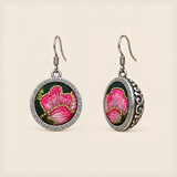 Rosy Aubade round earrings with pink embroidered petals, pale highlights, gold-colored outlines, geometric rims and domed backs.