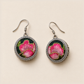 Rosy Aubade earrings laid front-facing, showing different arrangements of pink petals, gold-colored outlines and green accents.