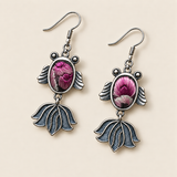 Petal Reverie handmade fish earrings, front flat lay