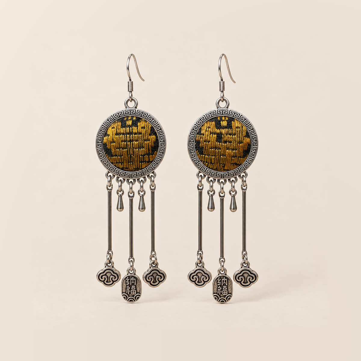 Golden Benediction earrings with golden-yellow geometric embroidery, three long rods, two short drops, cloud charms and central plaques inscribed 纳福.