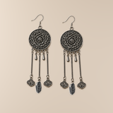 Golden Benediction earrings laid back-facing, showing flower relief, two short drops, cloud charms and central plaques inscribed 招財.