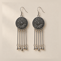 Pair of Pastel Refrain earrings laid flat with floral metal reverses facing up, each with five rods ending in teardrop, round, teardrop, round and teardrop shapes.