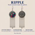 RIPPLE design card showing Pastel Refrain embroidered front and floral reverse, with counted-thread, round-form and reversible-design callouts.