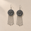 Violet Cadence pair laid flat with round floral metal reverses facing up, each with five oval-link chains ending in teardrop pendants.