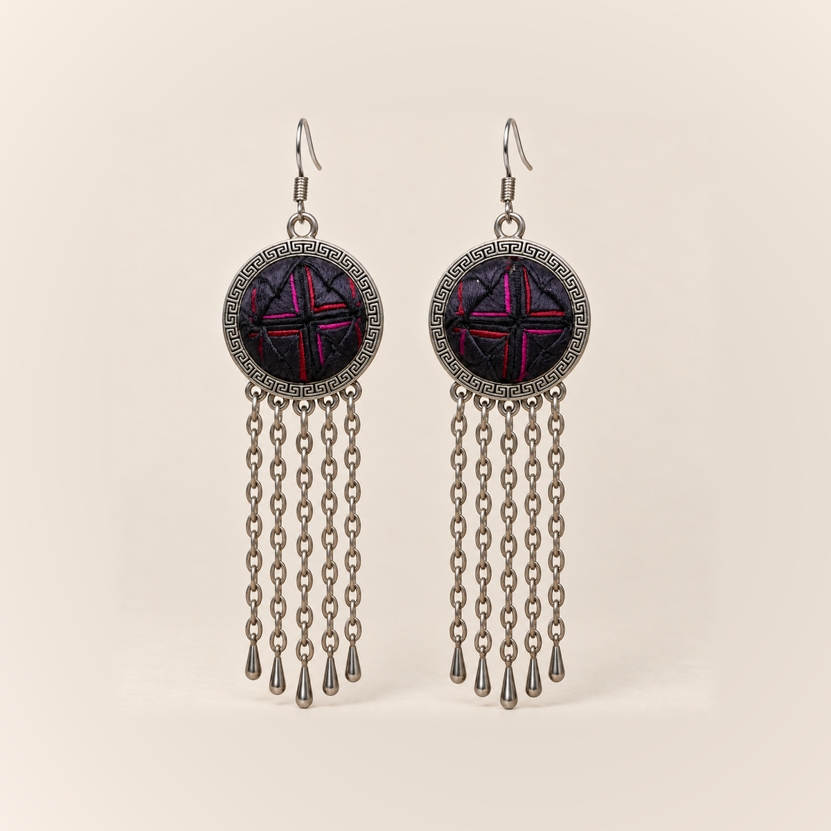 Crimson Confluence earrings with dark purple-black layered fabric and red and magenta folded edges in round frames, each with five long oval-link chains and teardrop ends.