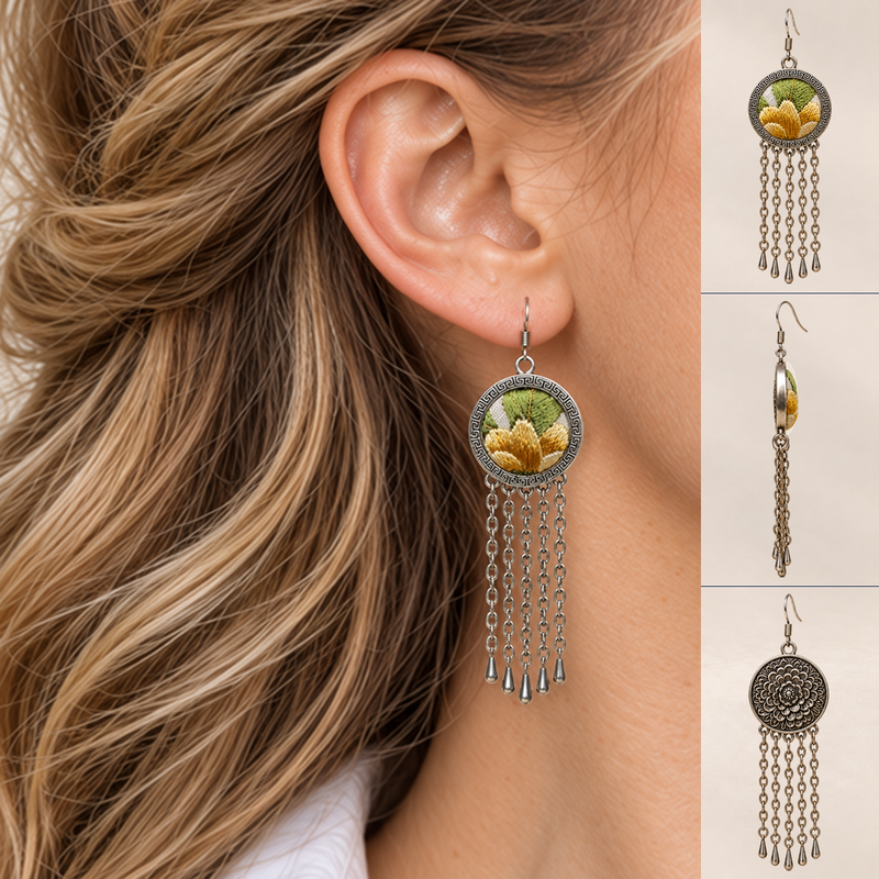 Model in a white collared shirt wearing Golden Solace earrings, beside front, side and floral reverse views showing five long chain tassels.