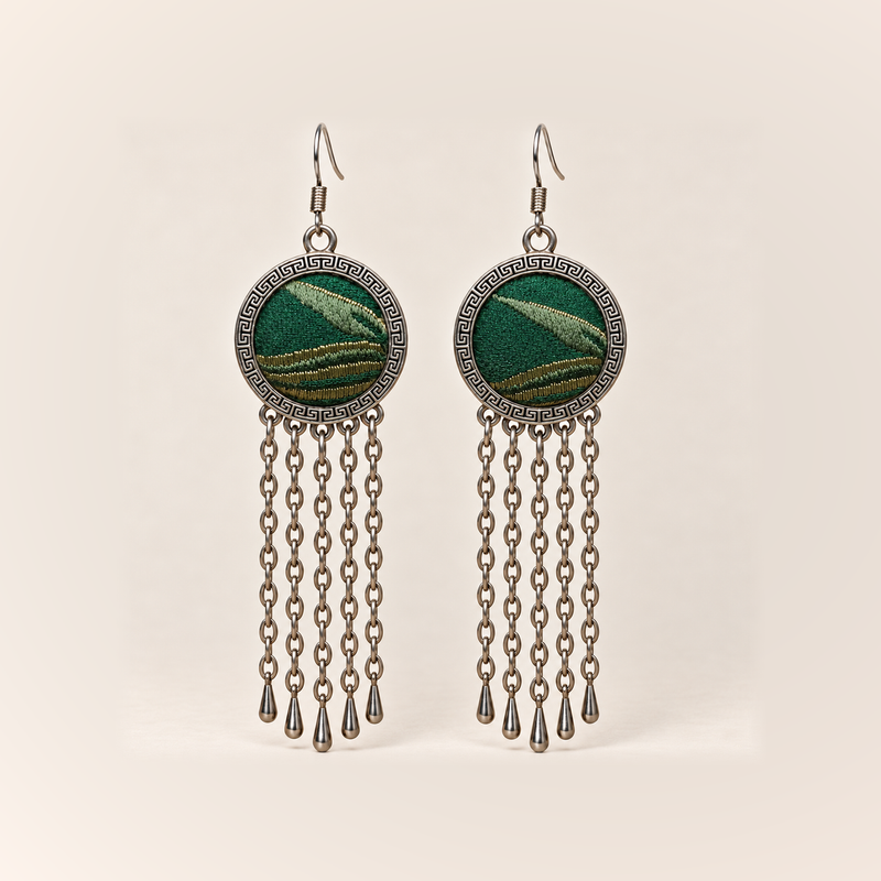 Verdant Concord earrings with emerald Song Brocade fronts, pale diagonal motifs, gold-olive curved bands and five long oval-link chains with teardrops.