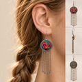 Model wearing Scarlet Affinity earrings with low braids and a camel-colored boat-neck top, beside front, side and floral reverse views.