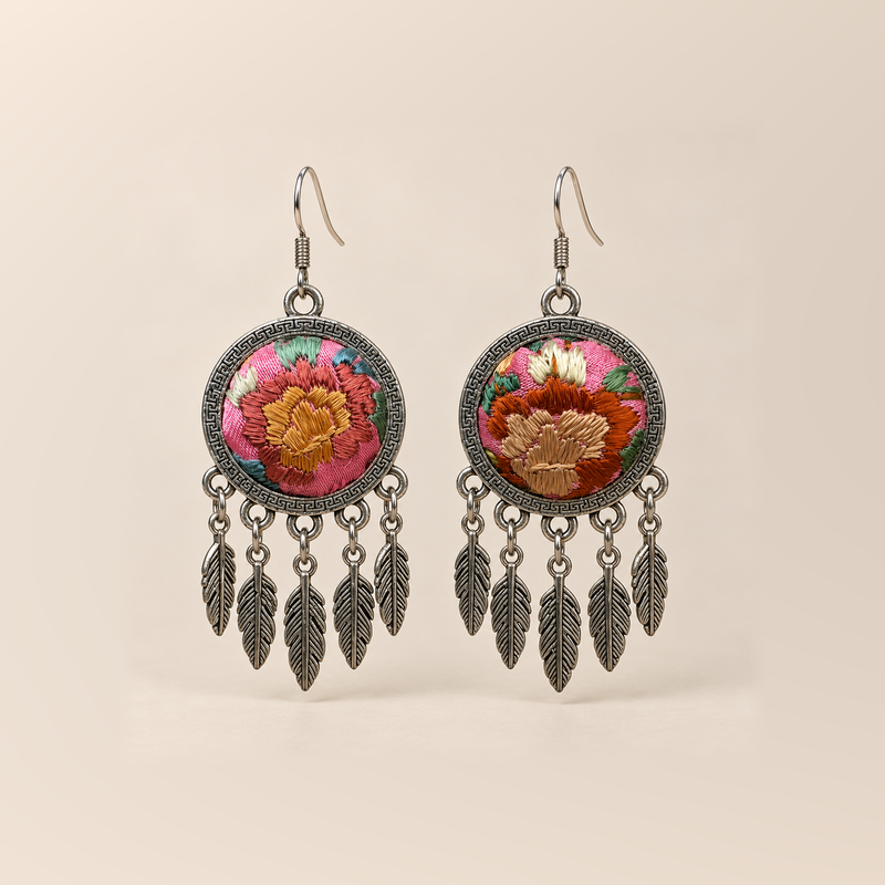 Garden Murmur Suzhou Embroidery earrings with warm floral fronts on pink and mint grounds, each with five short chains and flat leaf pendants.