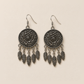 Pair of Garden Murmur floral metal reverses on cream cloth, each with five short connecting chains and flat veined leaf pendants.