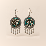 Teal Reverie Horsehair Embroidery earrings with cream raised curves over teal, black and olive stitching, patterned rims and five short teardrops.