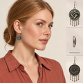 Model wearing Teal Reverie earrings with a low bun and terracotta collared shirt, beside full front and back views and a shell profile detail.